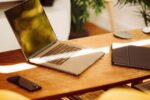 Laptop, tablet and mobile phone on a living room coffee table