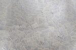 A large pile of documents covers the floor.